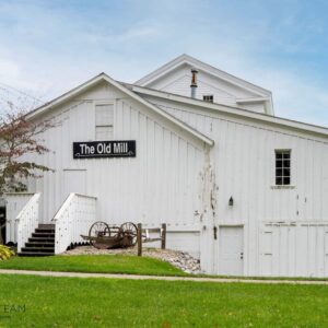 White Building with sign that says "The Old Mill"